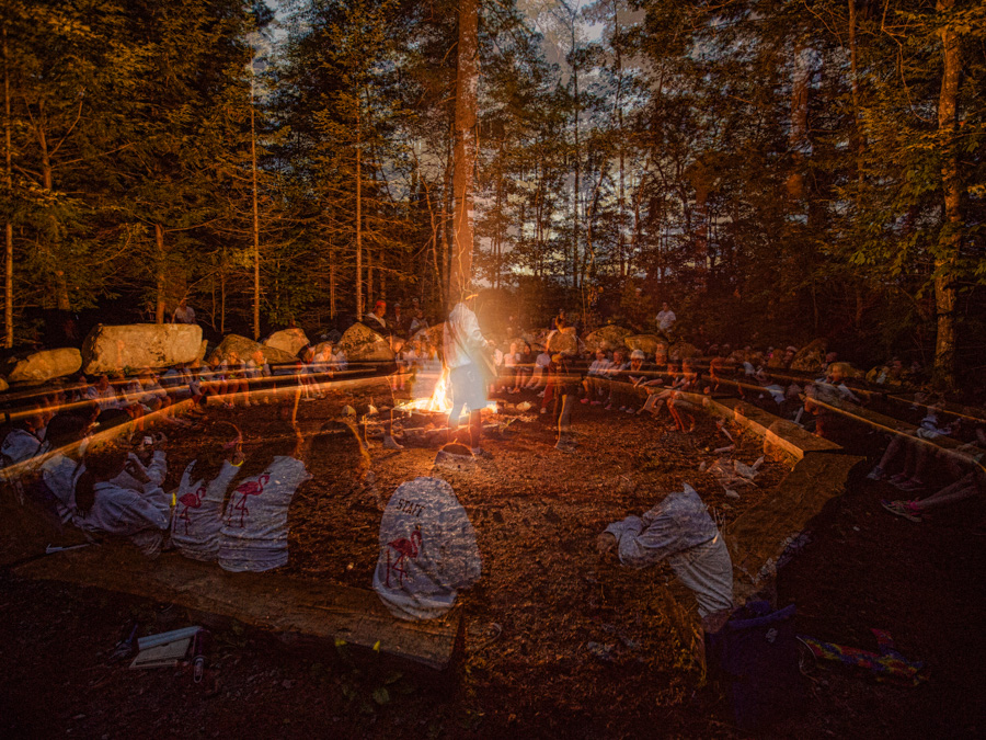 Campfire circle at night at Fernwood Cove